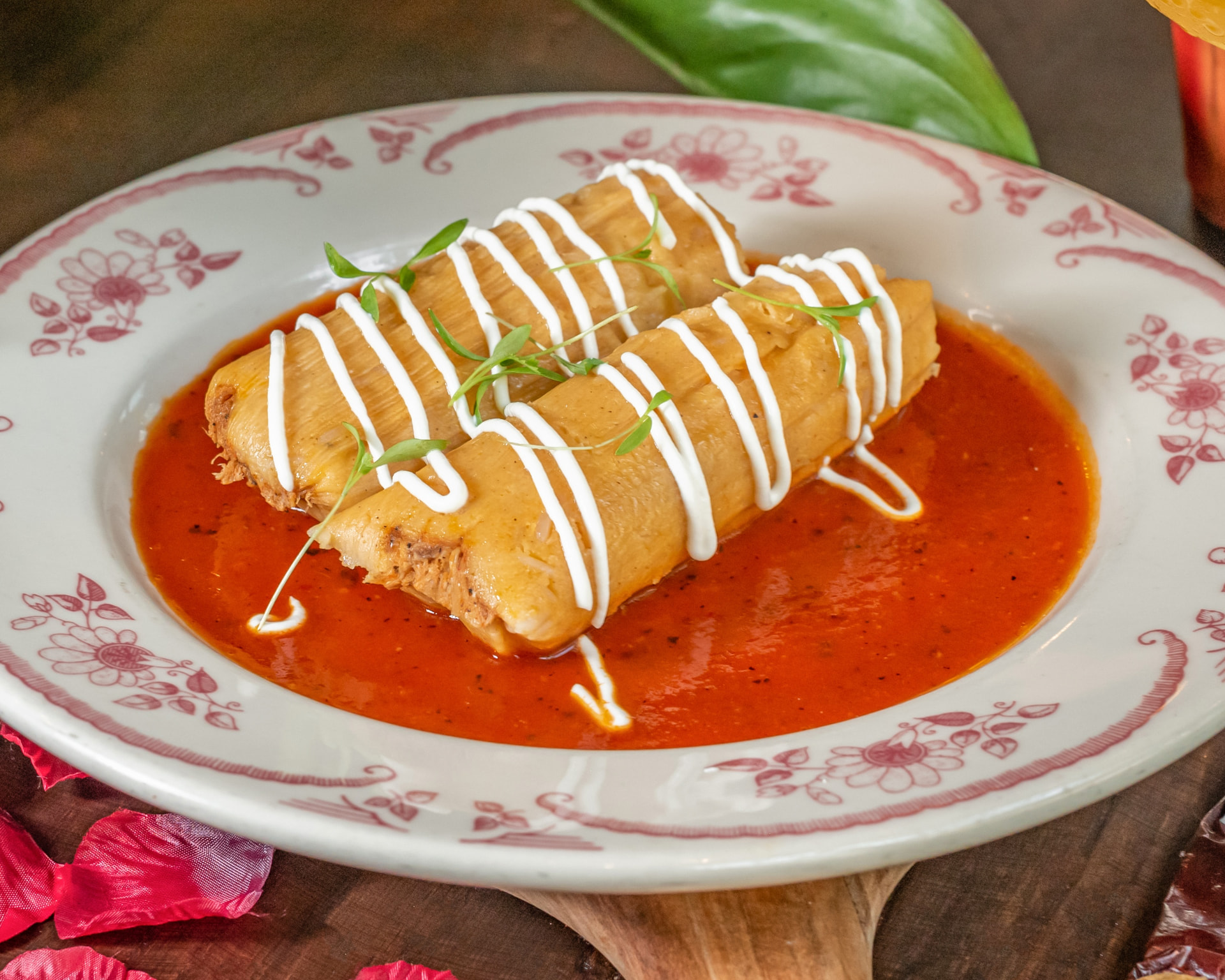 Tamales unwrapped on a plate